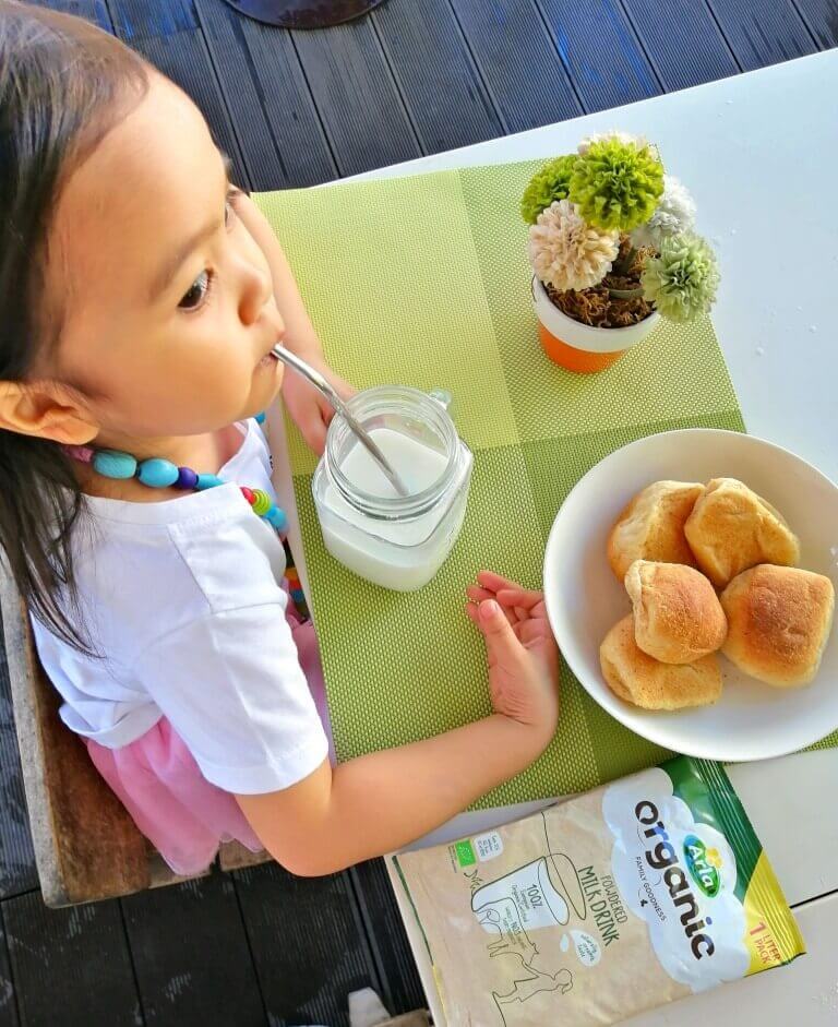 Kid drinking Arla Organic Powdered Milk